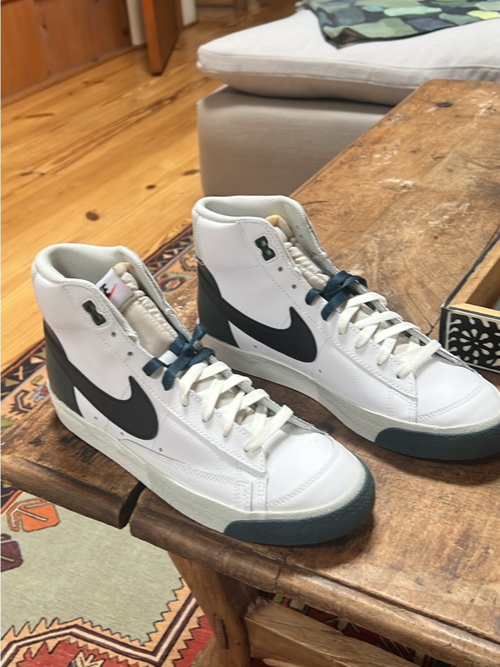 Nike White High-Top Sneakers with Black Swoosh and Dark Teal Accents